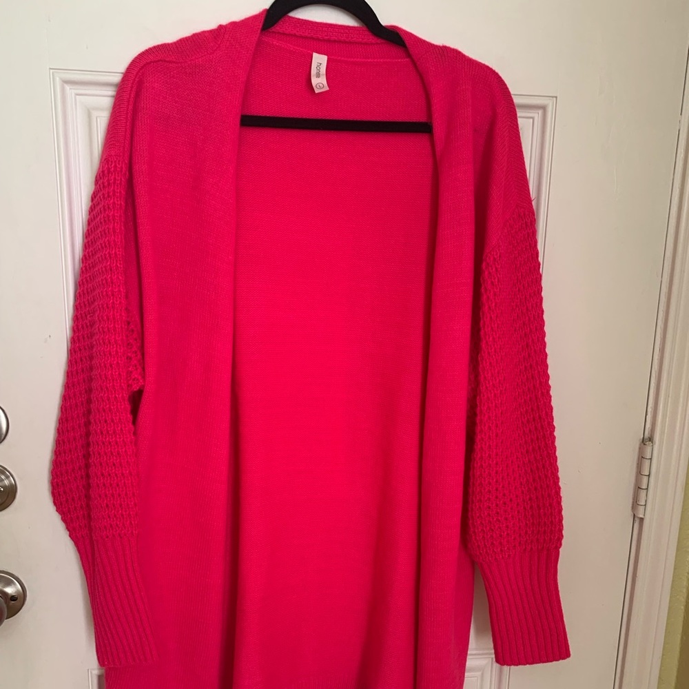 Honey Me sweater with waffle weave sleeves. Bright pink.